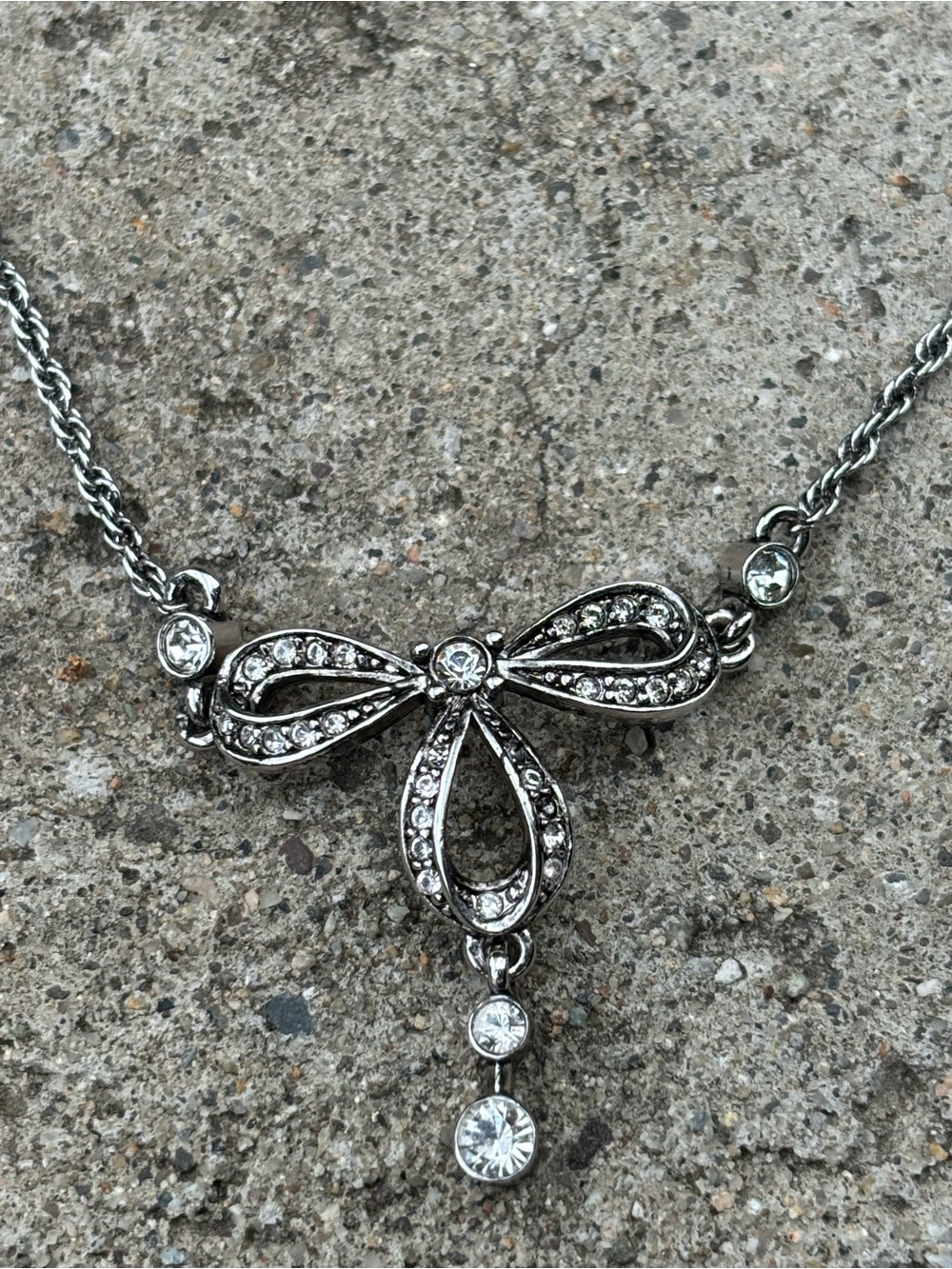 Nina Ricci Bow Pendant Necklace Rhodium Plated With Swarovski Crystals